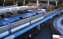 Monorail passing Autopia track